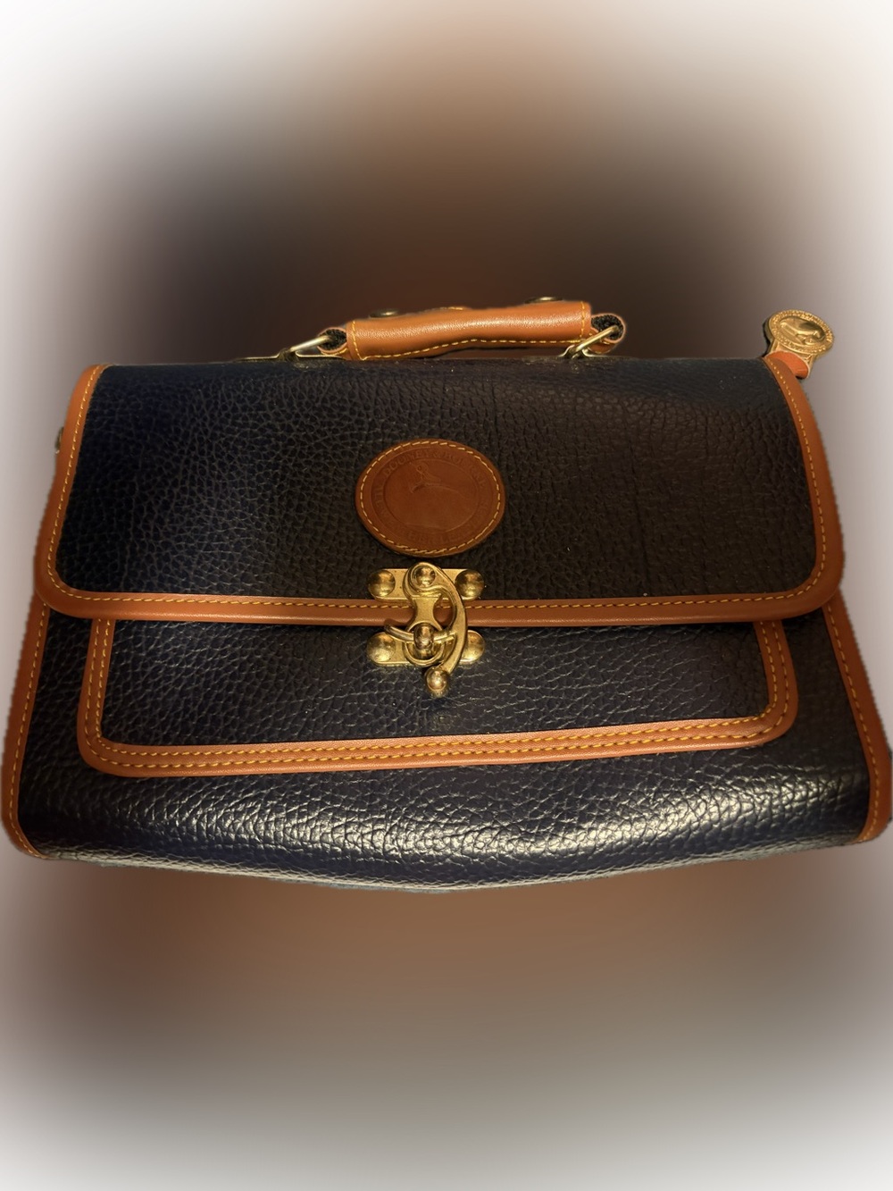 Dooney & Burke Textured Navy Blue Clutch with Tan Trim and Gold Hardware - Picture 2 of 7